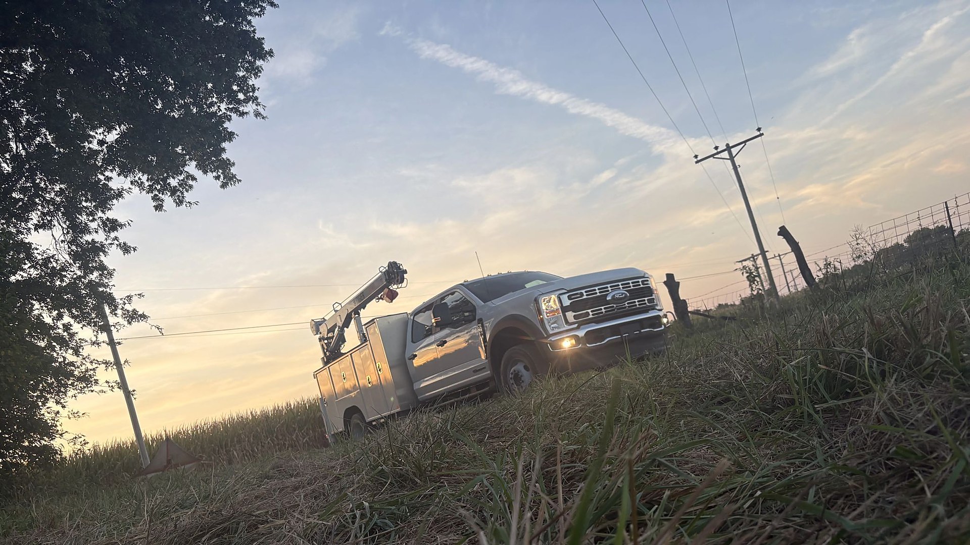 VOLTS service truck in the field at dusk